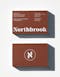 Business card for Julian Cook, executive director of Northbrook in rust colour with white typography